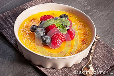 Creme brulee Dessert wih fruits and mint leaves Stock Photo