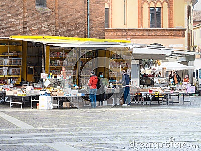 Cremona, Lombardy, Italy - 16 th may 2020 - People grocery shopping socially distance d in local biologic open air food market Editorial Stock Photo