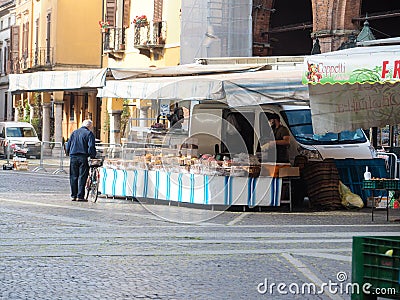 Cremona, Lombardy, Italy - 16 th may 2020 - People grocery shopping socially distance d in local biologic open air food market Editorial Stock Photo