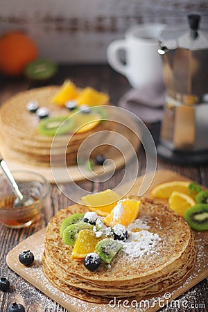 Crepes or bliny with fruits Stock Photo