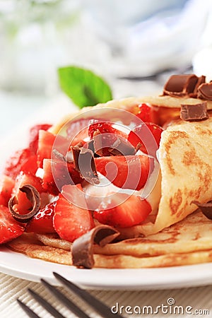 Crepes with curd cheese and strawberries Stock Photo