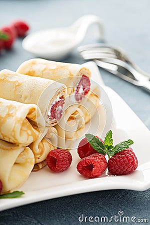Crepes filled with cottage cheese and raspberry Stock Photo