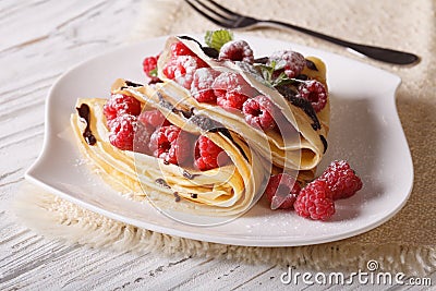 Crepes with raspberry berries and chocolate close-up Stock Photo