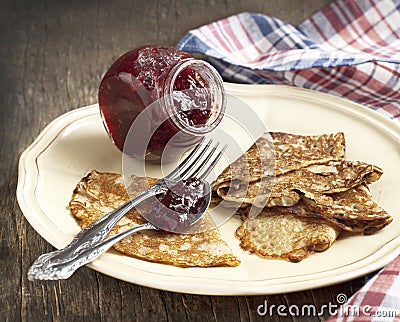 Crepes with raspberry jam Stock Photo