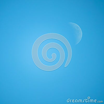 Crescent / half moon in the middle of the day with blue sky in t Stock Photo