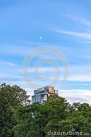 Crescent moon above the new luxury hotel - Hotel X Toronto, as sunset light hits the building Editorial Stock Photo