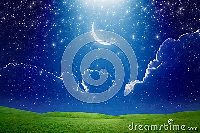 Crescent moon in dark blue starry sky, bright light beam from sk Stock Photo