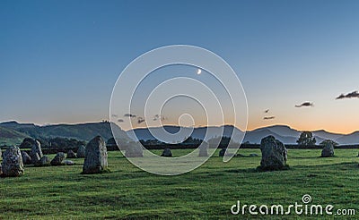 Crescent moon setting over the stone circle Stock Photo