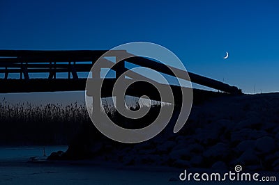 Crescent Moon in winter sky Stock Photo