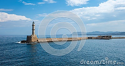 Crete Greece. Lighthouse, beacon at Venetian harbour in Old Town of Chania. Sunny day Stock Photo