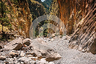 Tourists hike in Samaria Gorge in central Crete, Greece. The national park is a UNESCO Biosphere Rese Editorial Stock Photo