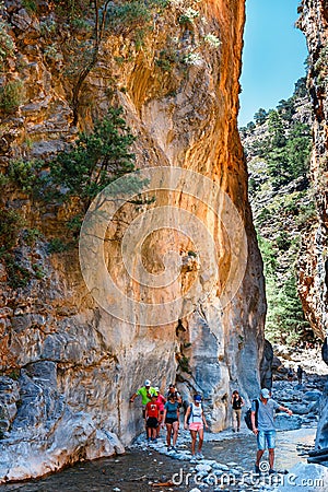 Tourists hike in Samaria Gorge in central Crete, Greece. The national park is a UNESCO Biosphere Rese Editorial Stock Photo