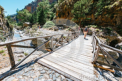 Tourists hike in Samaria Gorge in central Crete, Greece. The national park is a UNESCO Biosphere Rese Editorial Stock Photo