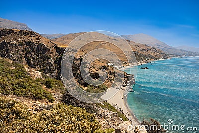 Crete's Coastal Gem: A Bird's-Eye View of Preveli Beach, Palm Grove, and Meandering Stream Stock Photo