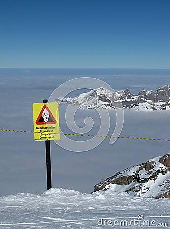 Crevasses, danger sign on the Titlis Stock Photo