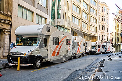 Crew cars with props for filming. Shooting a movie on the streets of the city. Backstage make-up rooms in cars Editorial Stock Photo