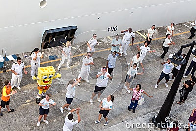 Crew and Passengers Dancing on Dock by Cruise Ship Editorial Stock Photo