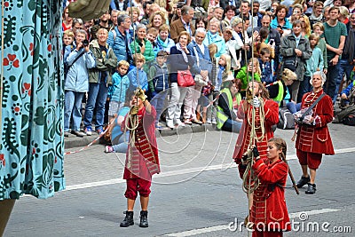Crew of Royal de Luxe theatre controlling giant mechanical doll Editorial Stock Photo
