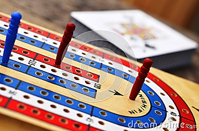 Cribbage board and playing cards Stock Photo