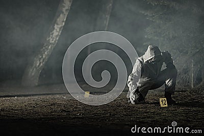 Crime Evidence Markers Placing by Forensic Officer Stock Photo