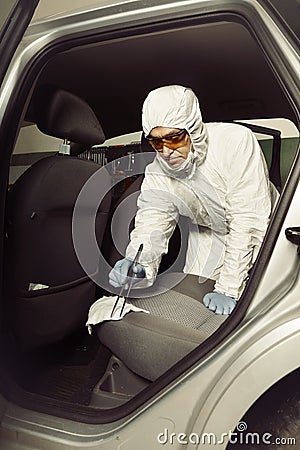 Police team working on odor traces in suspected confiscated car Stock Photo