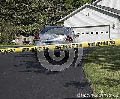 Crime scene marked off with tape Stock Photo