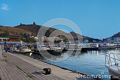 Crimea. Balaclava on the background of the ruins of the fortress Chembalo Stock Photo