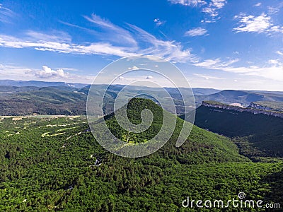 Crimean mountain in the middle of the trees. Photo from a height Stock Photo