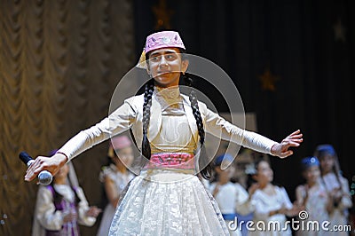 Crimean tartar children in native dresses performing native songs on stage Editorial Stock Photo