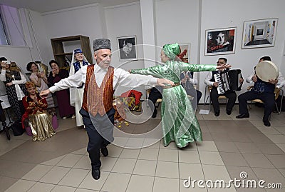 Crimean Tartar traditional wedding ceremony: groom dancing with bride Editorial Stock Photo
