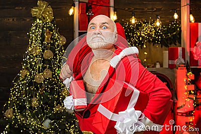 Criminal christmas. Funny Santas with bags - burglar or thief concept. Dangerous burglar dressed in Santa costume. Stock Photo
