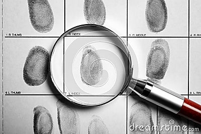 Criminal fingerprint card and magnifier Stock Photo