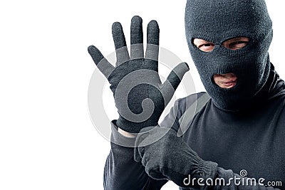 The criminal puts on a glove Stock Photo