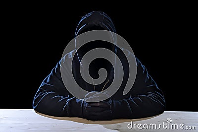 Criminal or terrorist man in mask hidden identity in secret illegal activity crime concept Stock Photo