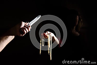 Criminal threatening Woman robs. Stock Photo