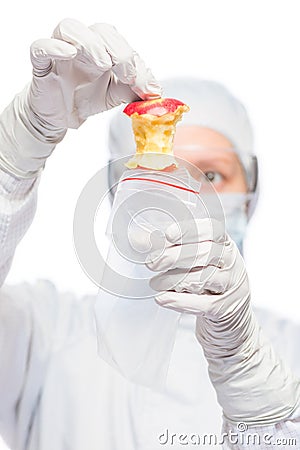 Criminologist in a suit puts evidence in the bag Stock Photo