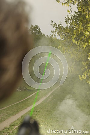 Measuring of bullet trajectory with ballistics trajectory laser and smoke on crime scene Stock Photo