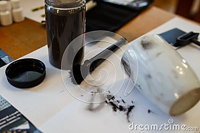 Criminology expert through a magnifying glass looking at evidence Stock Photo