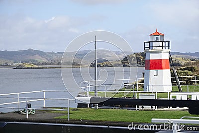 Crinan harbour at canal entrance and lighthouse in Argyll and Bute Scotland Stock Photo