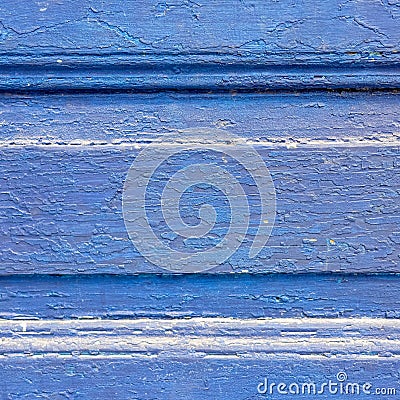 Crinkled bright blue painted wooden surface close up, vibrant monochrome texture. Stock Photo