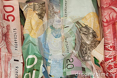 Crinkled Canadian dollar bills closeup Stock Photo