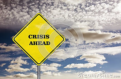 Crisis ahead road sign and blue sky Stock Photo