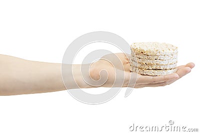 Round rice crispbreads in male`s hand isolated on white background Stock Photo