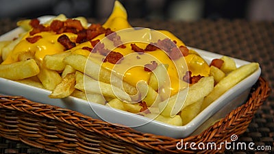 Crisp french fries with cheddar an bacon Stock Photo