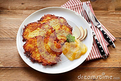 Crisp Fried Potato Rosti Served with Applesauce Stock Photo