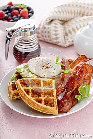 Crispy Belgian waffles with avocado and bacon for breakfast Stock Photo