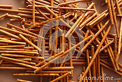Crispy bread straw on brown paper background Stock Photo