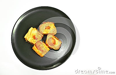 Crispy bread stuffed slice smoked pork sausage on plate Stock Photo