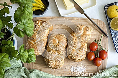 Crispy breakfast with savory baked goods richly served with fresh vegetables Stock Photo