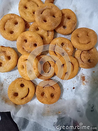Crispy buiskit with smily face Editorial Stock Photo